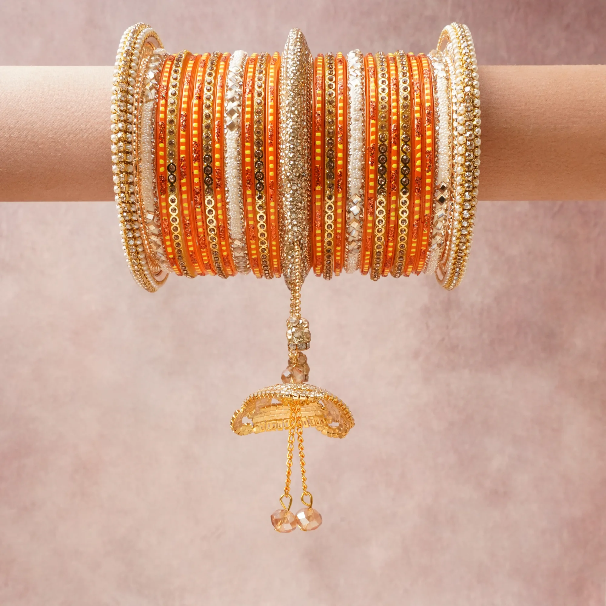 A grounding Orange forms the heart of the set, while touches of Gold, Cream, Clear add charm.

A thoughtful composition of Resin, Gold-toned Metal, Seed Beads, Faux Pearls, Rhinestones, Mirror Inlay, designed to feel complete without being heavy.
Each element layers seamlessly, creating a look that is refined, wearable and quietly striking.